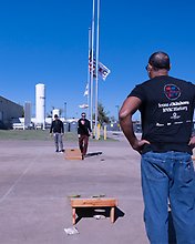 IEC employees play Cornhole during IEC's 75th Anniversary Celebrations!